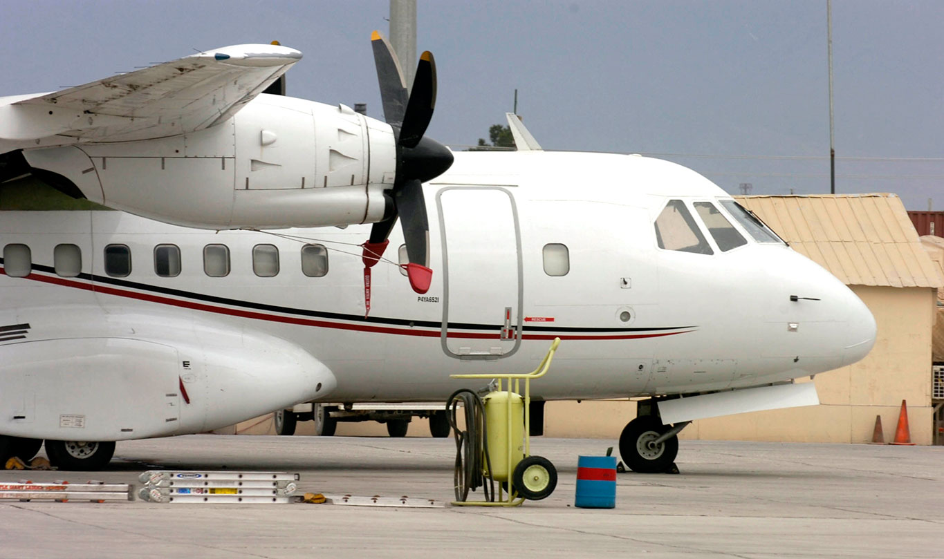 A Presidential Airways Casa CN-235-10 with 53rd Movement Control Battalion (Echelons Above Corps) is parked on the flight line on Dover Air Force Base, Del., March 30, 2009, as it receives maintenance. The aircraft is used to move passengers, palettes and mail. It can carry twice as much as the Casa C-212 Aviocar aircraft and requires three crew members on all missions. (U.S. Army photo by Pvt. Cody A. Thompson)