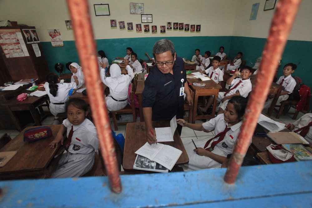A teacher checks